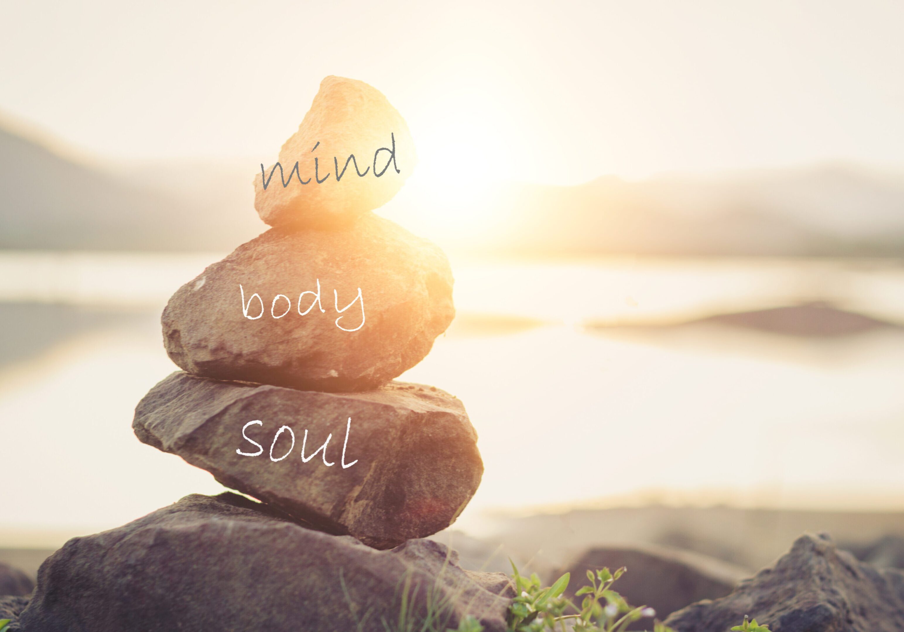 Stacked stones labeled mind, body, soul